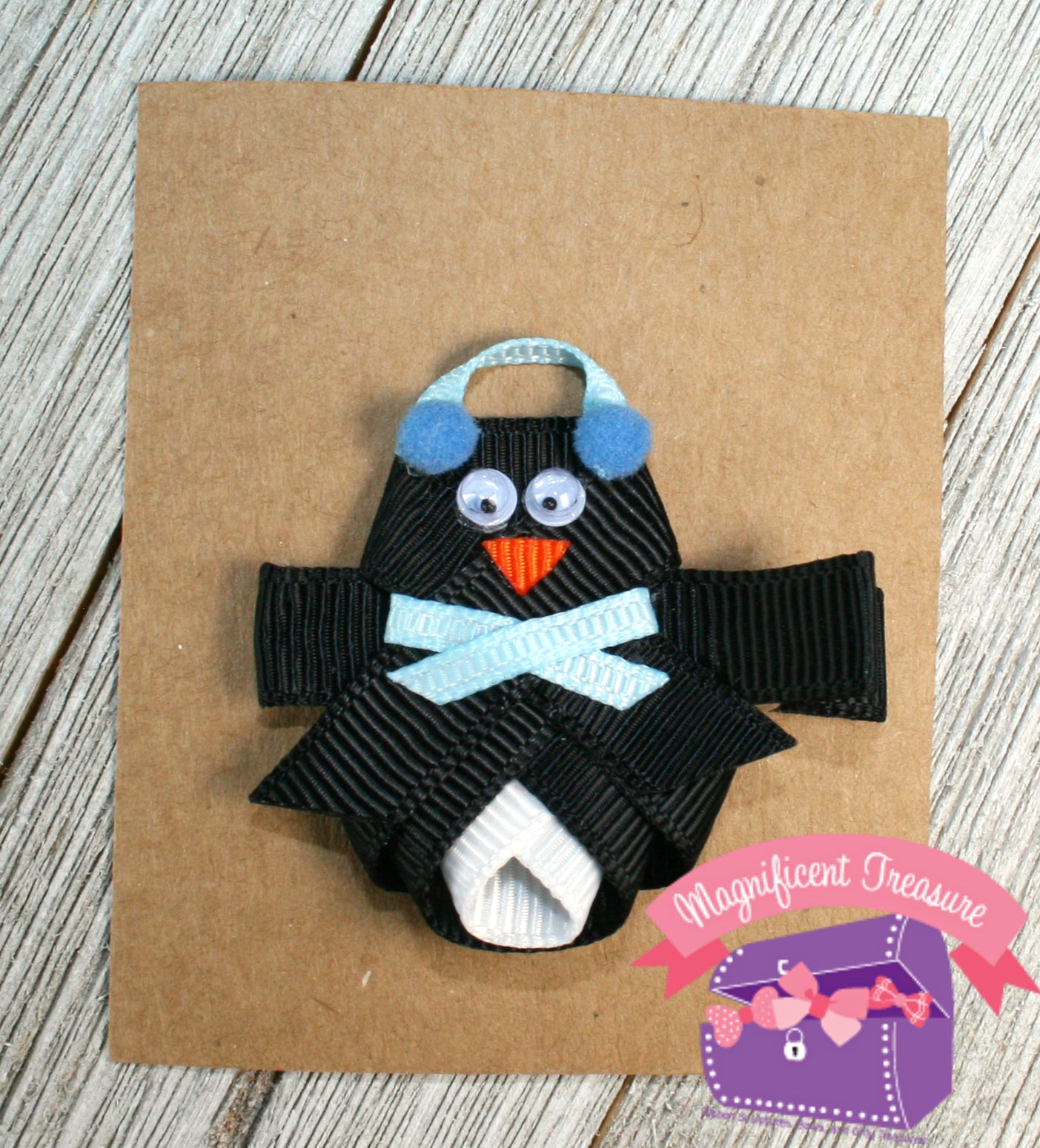 Penguin ribbon sculpture hair bow with earmuffs and scarf front view single blue